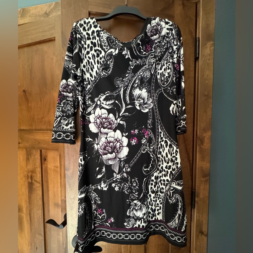 Classy fitted dress with soft drooped neck line. Flattering. Size M.